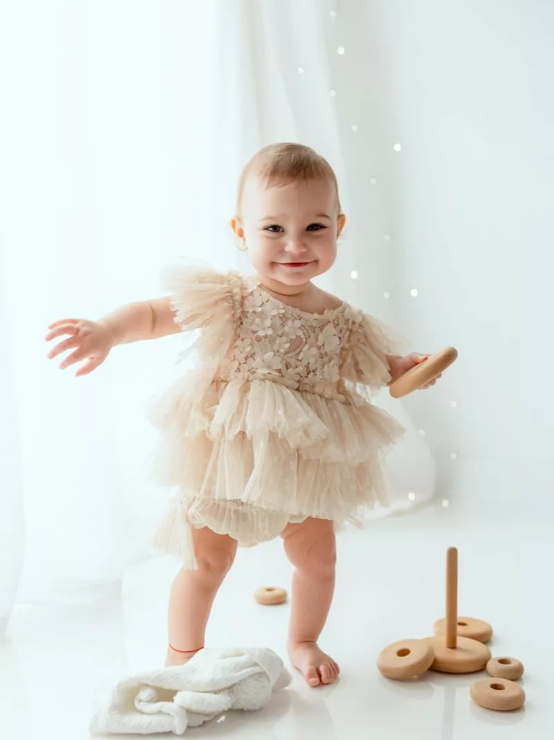 Smiling baby girl in a tulle dress