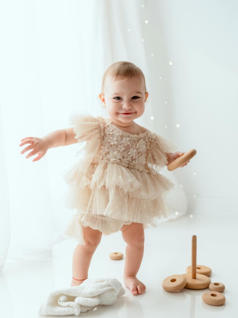 Smiling baby girl in a tulle dress